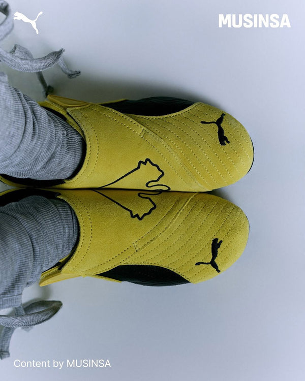 Puma Slipcat em destaque em ambiente urbano noturno minimalista 